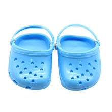 blue dog slippers on a white background
