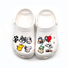 white crocs with charms on a white background