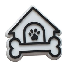 black and white dog house inspired crocs jibbitz on a white background