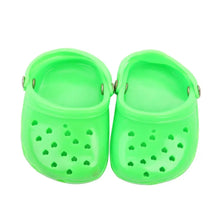 green dog slippers on a white background
