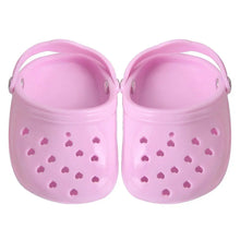 pink dog slippers on a white background
