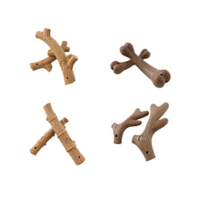 4 chew toys on a white background