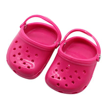 pink dog slippers on a white background