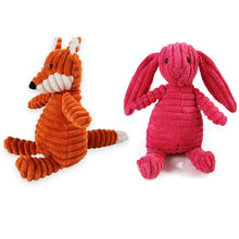 variety of plush chew toys on a white background