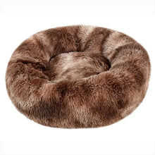 Brown fluffy donut dog bed with lighter stripe detailing, a soft shaggy surface, raised outer edge and cushioned centre