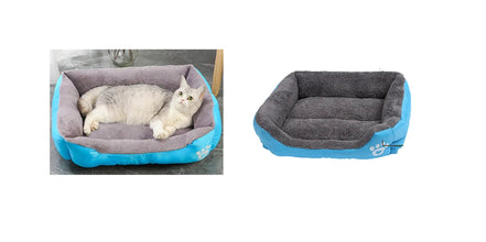 White cat resting in a blue and grey plush pet bed with raised cushioned sides and a soft padded base