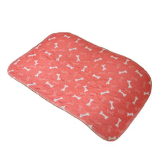 Coral quilted washable dog pee pad with white bone print for reusable indoor puppy training