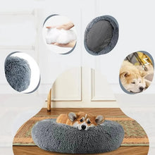 Corgi resting in a grey fluffy donut dog bed with a soft shaggy surface, cushioned centre and non-slip base
