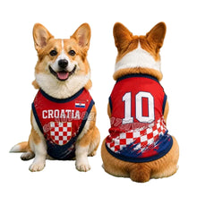 Corgi wearing a red Croatia 10 football-style dog jersey with navy trim and checkered detailing