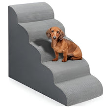 Dachshund sitting on grey foam pet stairs with wide steps for easier access to beds and sofas