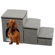 Dachshund beside grey three-step pet stairs with padded steps and a built-in enclosed pet house