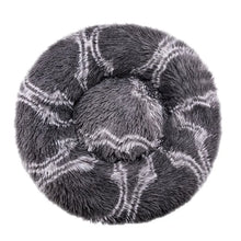 Dark grey fluffy donut dog bed with a white plaid pattern, soft shaggy surface, raised outer edge and cushioned centre