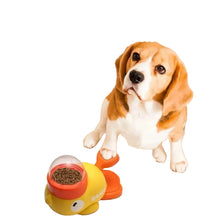 Beagle using a duck-shaped interactive dog food dispenser with kibble container and paw-operated button