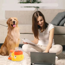 Golden retriever beside a duck-shaped interactive dog treat dispenser during indoor training at home