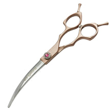 Gold and silver curved dog grooming scissors with ergonomic finger rings for shaping and trimming pet coats