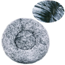 Grey and black fluffy donut dog bed with a soft faux fur surface, raised outer edge and close-up detail of the long plush fibres