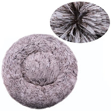 Grey melange fluffy donut dog bed with a soft faux fur surface, raised outer edge and close-up detail of the long plush fibres.