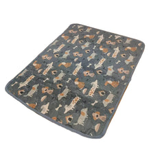 Grey quilted waterproof pet mat with a playful dog and bone print, designed for beds, crates or resting areas