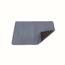 Grey quilted waterproof pet bed protector mat with a padded surface and dark non-slip backing