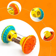 Interactive dog treat dispenser toy with adjustable food openings, textured wheels and a clear chamber filled with kibble