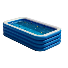 Large blue rectangular inflatable dog pool filled with water and small floating balls