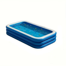 Large blue rectangular inflatable dog pool filled with water and small floating balls
