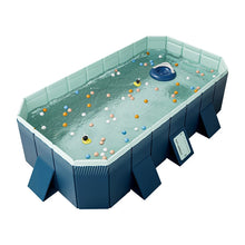Large rectangular dog swimming pool filled with water and floating toys, with reinforced side panels and support legs
