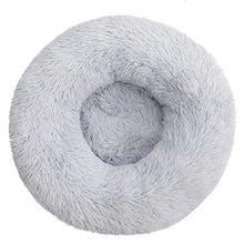 Light grey fluffy donut dog bed with a soft shaggy surface, raised outer edge and cushioned centre