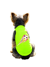 Small curly-haired dog wearing a neon green soccer-themed shirt with a colourful football graphic on the back