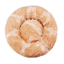 Orange fluffy donut dog bed with white stripe pattern, soft plush surface, raised outer edge and cushioned centre