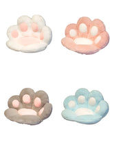 Plush paw-shaped pet beds in white, pink, grey and light blue colour options for cats and small dogs