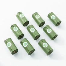 green dog doop bags with dispenser on a white background