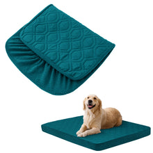 dog laying on the bed with folded cover on a white background