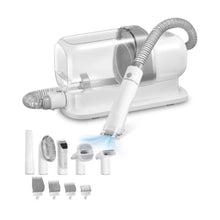 Pet grooming vacuum with hose and grooming attachments