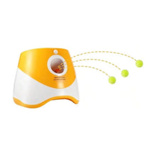 Yellow automatic ball launcher with three tennis balls