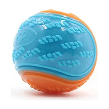 Blue and orange textured squeaky ball on white