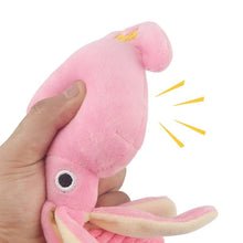octupus plush toy squeeze by a hand with a white background