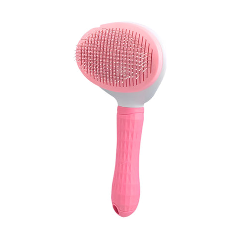 Pink round pet grooming brush