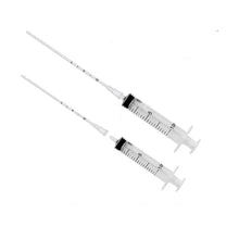 Pet feeding tubes and syringes on white