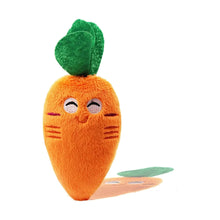 Orange plush carrot toy with green leaves