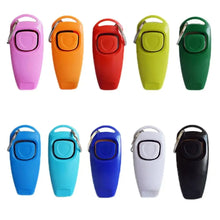 different colors of dog whistle and clicker on white background