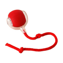 Red rolling ball toy with attached rope tail
