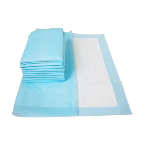 Blue disposable training pads stacked beside an unfolded pad