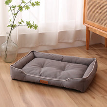 grey pet bed displayed indoor on a cosy home