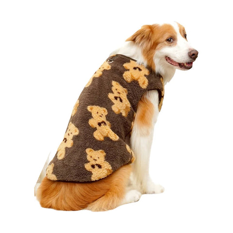 Dog wearing brown fleece pyjamas with a bear pattern