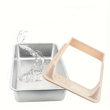 Stainless steel cat litter box with removable beige high-sided guard and water splash showing easy-clean design