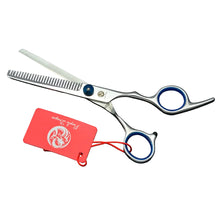 Silver dog grooming thinning shears with blue finger rings and toothed blade for blending and thinning pet coats