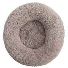 Taupe fluffy donut dog bed with a soft shaggy surface, raised outer edge and cushioned centre